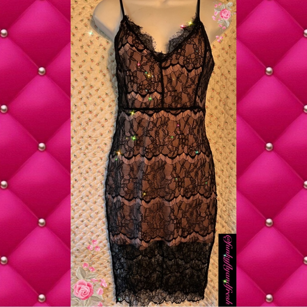Nordstrom/Angl size small black lace and nude lining. Above the knee zip back